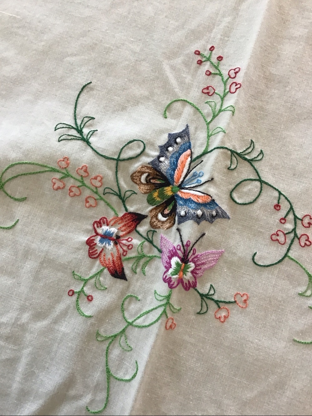 Beautifully Hand stitched embroidered tablecloth with butterflies and flowers.